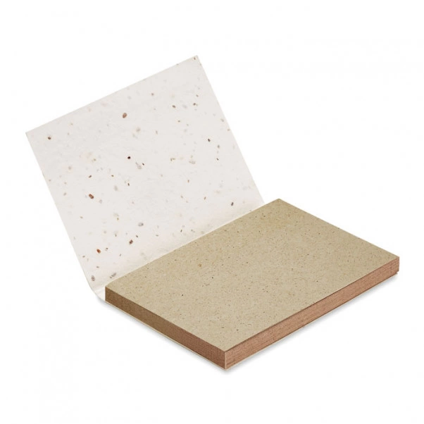 Bloc notes écologique à personnaliser ouvert. Couverture en papier avec des graines à planter dedans. Fabriqué en Europe.